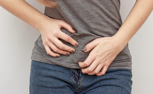 כאב בטן (צילום: Simikov, shutterstock) כאב בטן (צילום: Simikov, shutterstock)